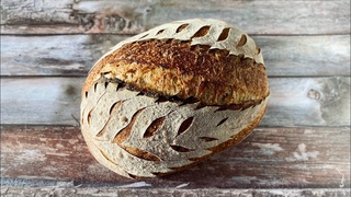Leaves scoring on sourdough bread