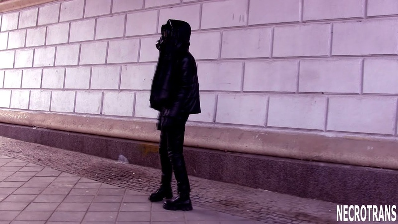 Post apocalyptic. Walking in black leather suit, a black leather down jacket with a hood + gas